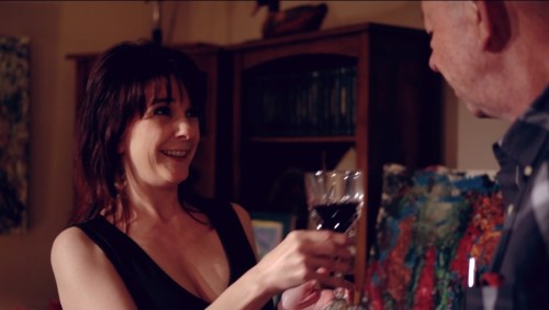 Rose (Tiffany Patch) toasts Paul (John Daws) saying, "Wine makes things rosier."