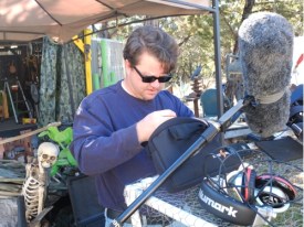 Mr. Bones watches Jason Marion ready the sound recording gear