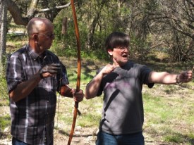 John & Rodger consider good form in archery.