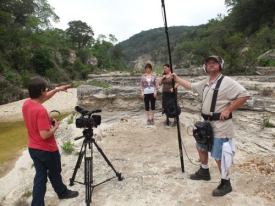 Rodger discusses the shot with Tiffany and Celeste. Jason stands guard (apparently). 